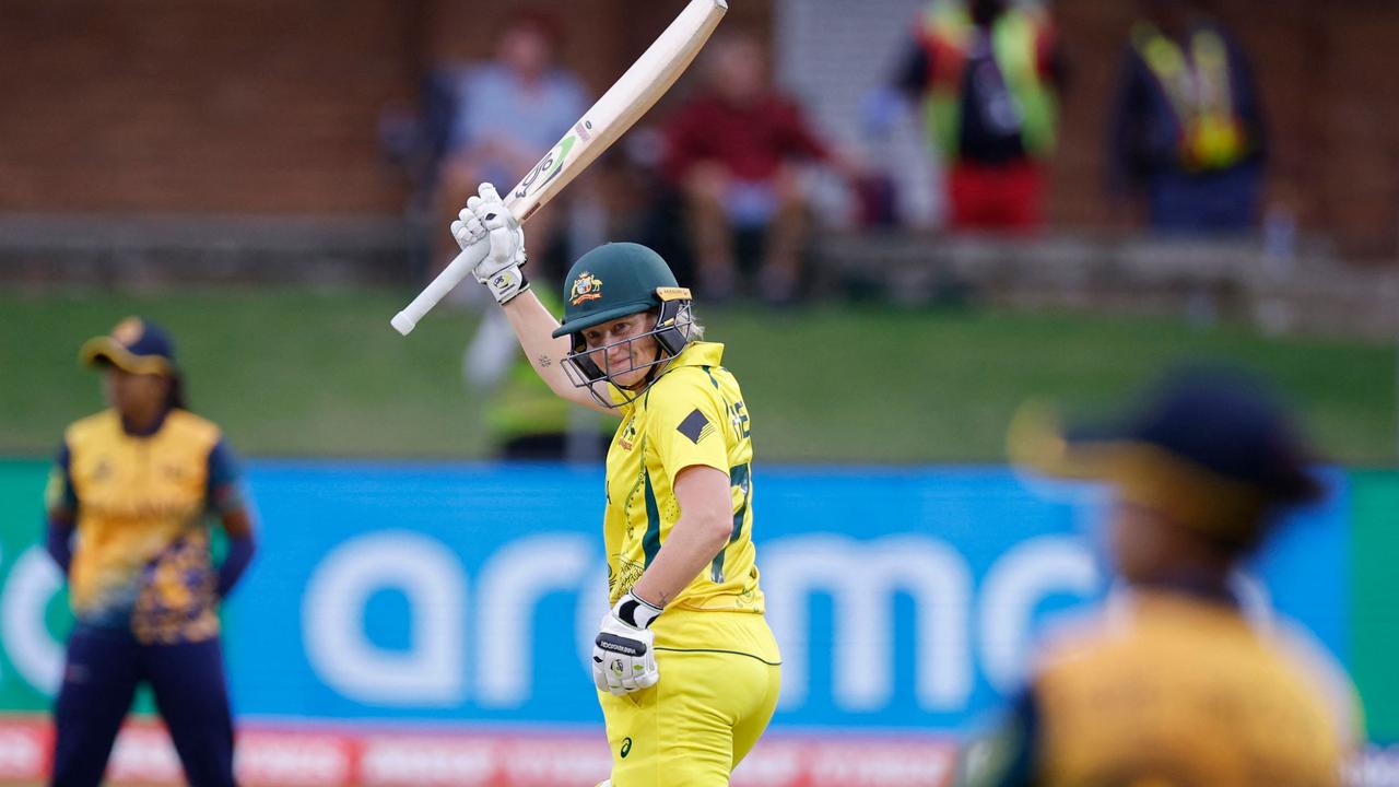 Alyssa Healy celebrates after scoring a half-century . (Photo by Marco Longari / AFP)