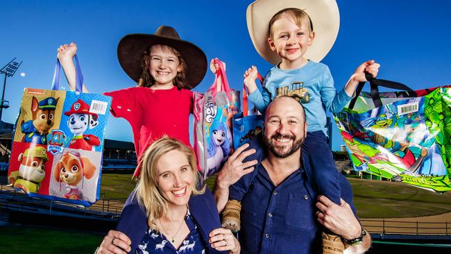 Ekka Tickets 2023. Tina and Tony White with their kids Lincoln, 4 and Felicity, 8 with showbags ahead of the Ekka. Picture: Nigel Hallett