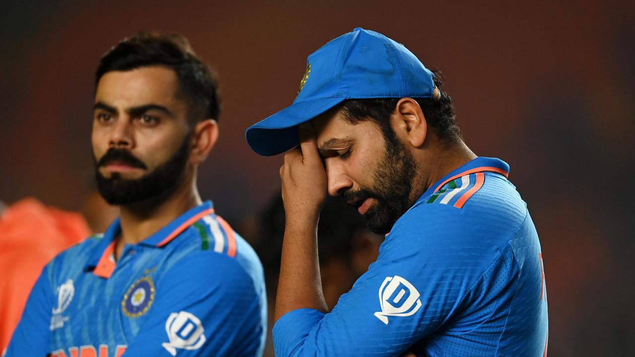 Rohit Sharma (R) and Virat Kohli react to their crushing defeat in their home World Cup. Picture: Getty