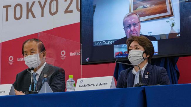 The show must go on? Tokyo 2020 chief executive Toshiro Muto (left), Tokyo 2020 Olympics organising committee president Seiko Hashimoto (right) and International Olympic Committee vice-president John Coates. Picture: AFP