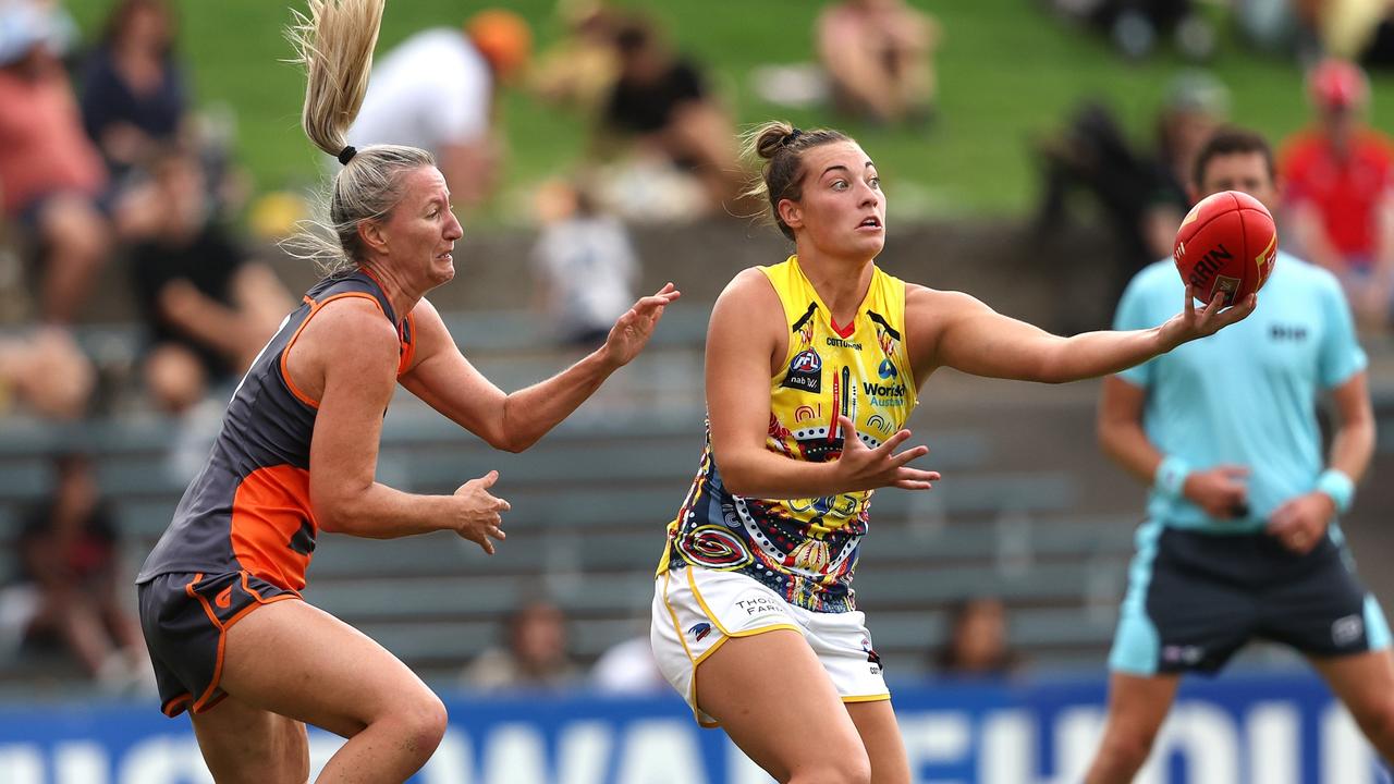 Adelaide's Caitlin Gould marks in front of Giant Tanya Hetherington on Saturday. Picture: Phil Hillyard