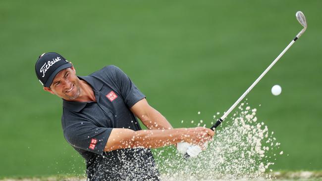 Adam Scott digs one out of the bunker. Picture: Getty