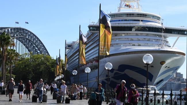 Cruise ship passengers disembark from the ill-fated Ruby Princess at Circular Quay in Sydney on March 19. Picture: Dean Lewins/AAP