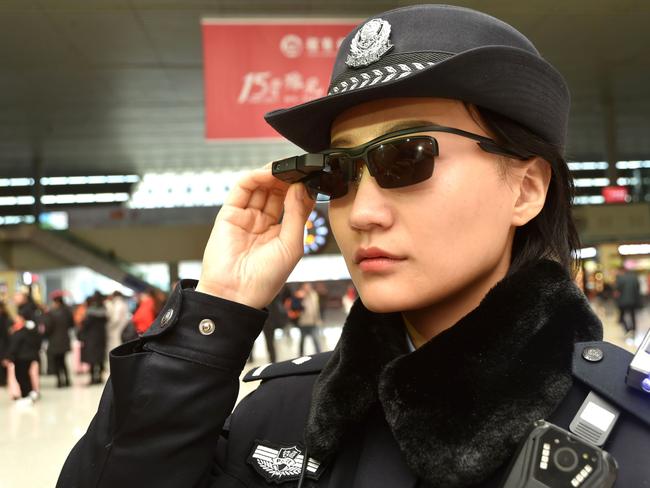 Chinese police are sporting high-tech sunglasses that can spot suspects in a crowded train station, the newest use of facial recognition technology that has drawn concerns among human rights groups. Picture: AFP
