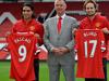 Manchester United's Dutch manager Louis van Gaal (C) poses for photographs along with the club's latest signings Colombian striker Radamel Falcao (L) and Dutch midfielder Daley Blind (R) during their unveiling at Old Trafford in Manchester on September 11, 2014. AFP PHOTO/STEVE PARKIN - RESTRICTED TO EDITORIAL USE. No use with unauthorized audio, video, data, fixture lists, club/league logos or “live” services. Online in-match use limited to 45 images, no video emulation. No use in betting, games or single club/league/player publications.