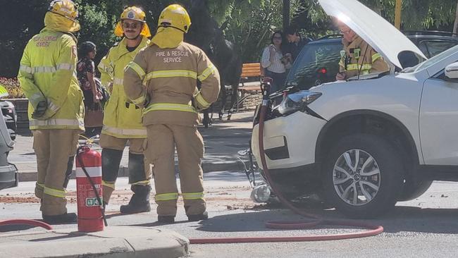 The white Nissan X-Trail came to rest on top of the black motorcycle. Picture: NCA NewsWire / Anthony Anderson