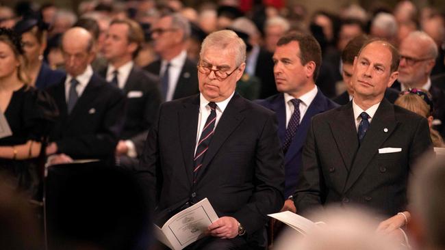 Prince Andrew, Duke of York (centre) with his brother, Prince Edward. Picture: Richard Pohle/AFP