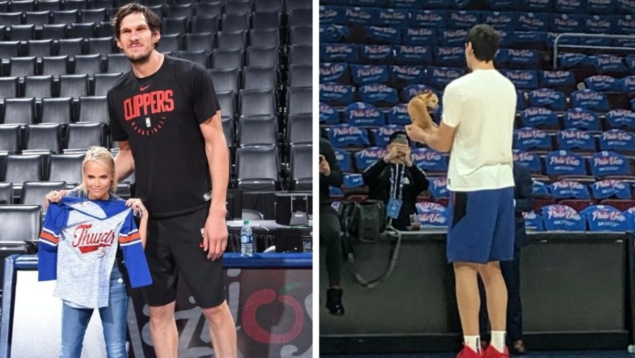 Dallas Mavericks' Boban Marjanovic shakes hands with a fan prior