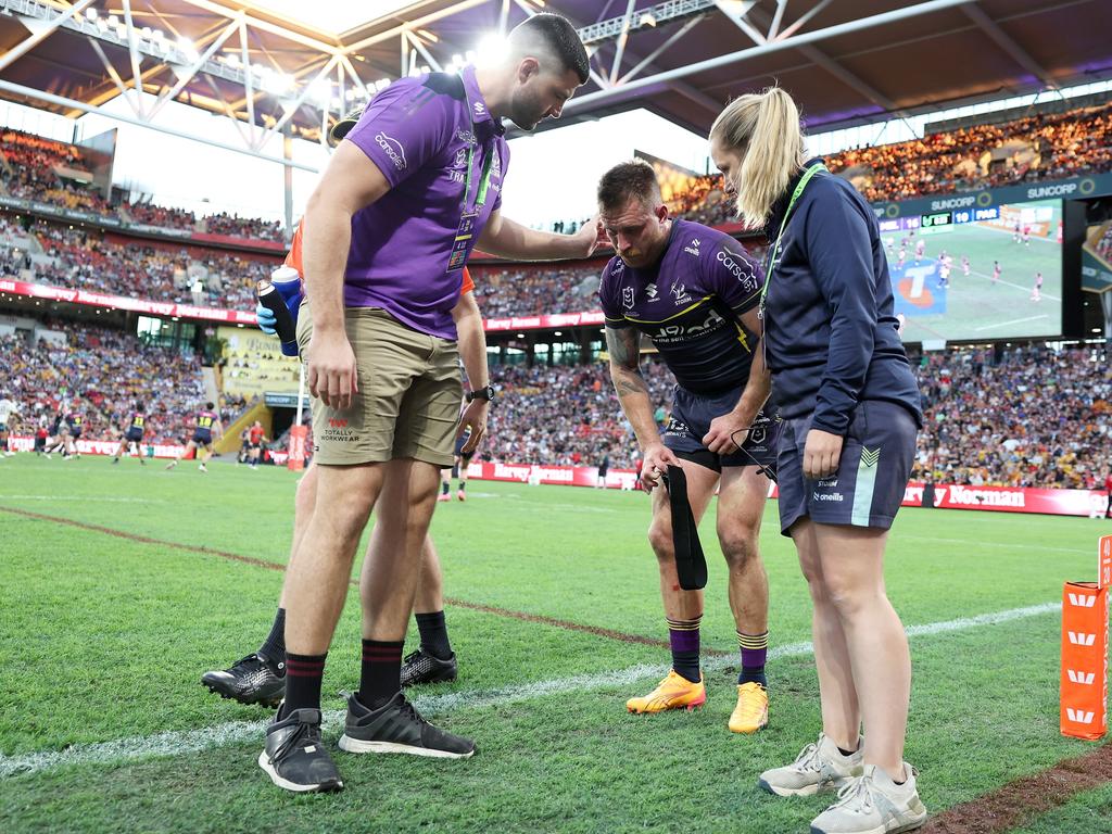 Cameron Munster limps from the field. Picture: Hannah Peters/Getty Images