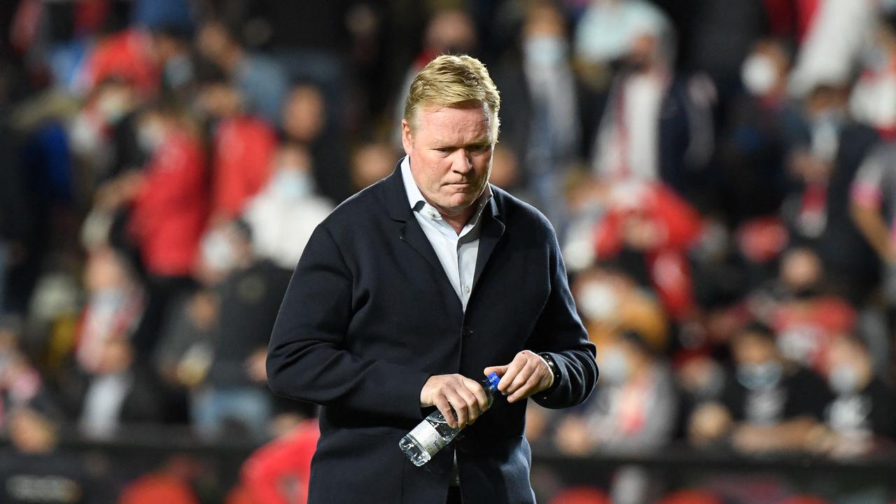 Barcelona's Dutch coach Ronald Koeman reacts during the Spanish League football match between Rayo Vallecano de Madrid and FC Barcelona at the Vallecas stadium in Madrid on October 27, 2021. (Photo by OSCAR DEL POZO / AFP)