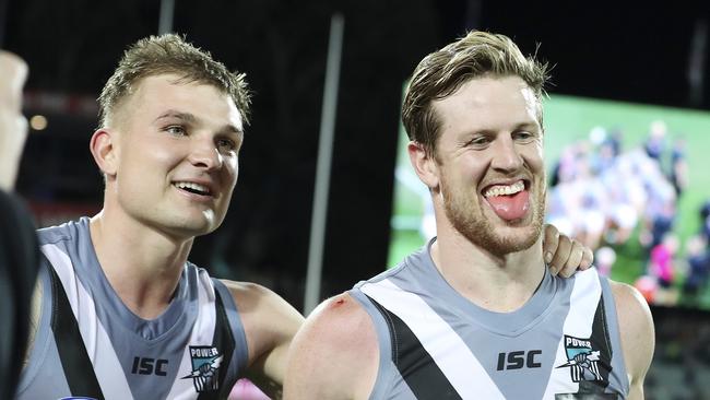 Port Adelaide co-captains Ollie Wines with Tom Jonas after the Power’s Showdown win. Picture SARAH REED