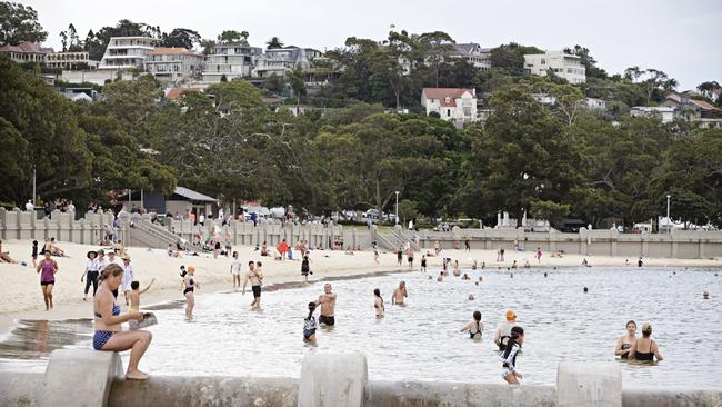 Sydneysiders beat the heat by going for an early morning dip. Balmoral was busy by 7am. Picture: Adam Yip