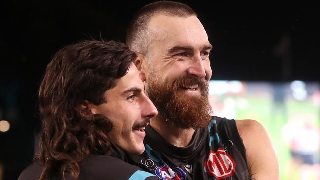 Charlie Dixon (right) enjoys a win in his first game for the season. Picture: Sarah Reed/AFL Photos via Getty Images