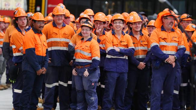 Workers at the Downer rail manufacturing facility at Maryborough on Monday during the state government’s announcement to deliver the new $7bn train program. Picture: Lachie Millard