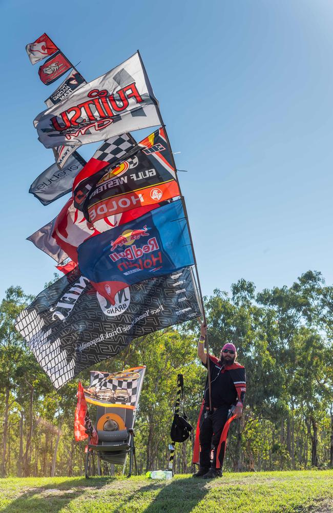 Anthony James Hobden and his massive flag collection at the 2020 Darwin Triplecrown. Picture: Che Chorley