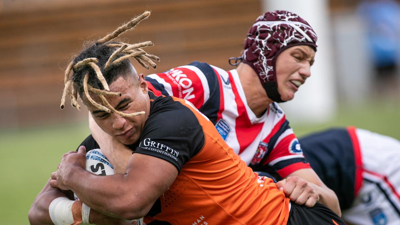 Xavier Tauaifaiga causing havoc for the Roosters player: Picture: Julian Andrews