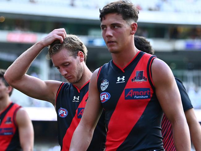 MELBOURNE, AUSTRALIA - MARCH 19: The Bombers look dejected after losing the round one AFL match between the Geelong Cats and the Essendon Bombers at Melbourne Cricket Ground on March 19, 2022 in Melbourne, Australia. (Photo by Quinn Rooney/Getty Images)