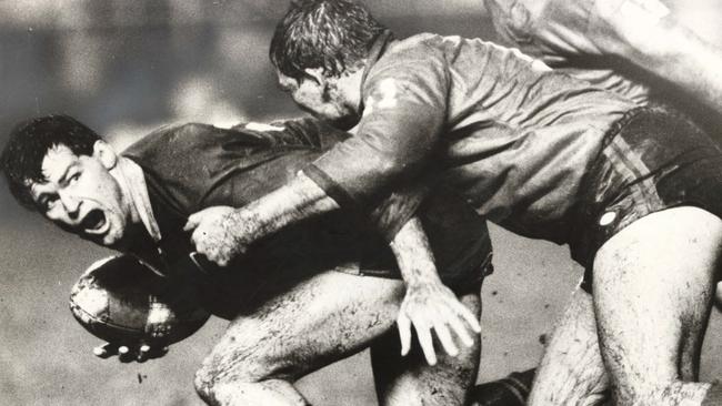 Queensland’s Bob Lindner braces himself as Steve Roach is about to hit him.