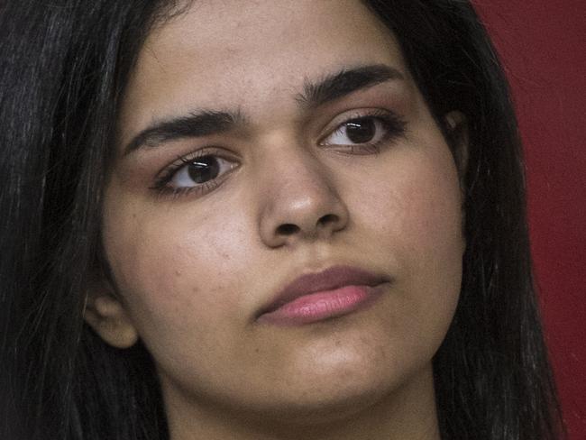 Rahaf Mohammed Alqunun makes a public statement in Toronto, Tuesday, Jan. 15, 2019. The Saudi teen whose flight from her family captured global attention says she intends to fight for the freedom of women around the world. The 18-year-old ran from her family, whom she alleged was abusive and trying to force her into an arranged marriage.  (Tijana Martin/The Canadian Press via AP)