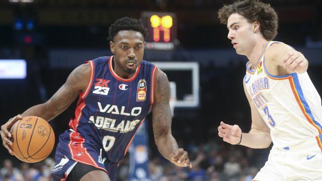 Robert Franks #0 of the Adelaide 36ers dribbles past Josh Giddey #3 of the Oklahoma City Thunder