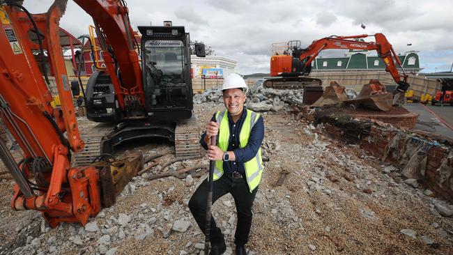 Ardent Leisure CEO Greg Yong stands in the rubble of the old entry pool which is making way for a new attraction. The Dreamworld Flyer is planned to rise next to the iconic Dreamworld Globe when the attraction opens in late 2023, redefining the park’s famed entryway for all current and future generations to enjoy for years to come. Picture: Glenn Hampson