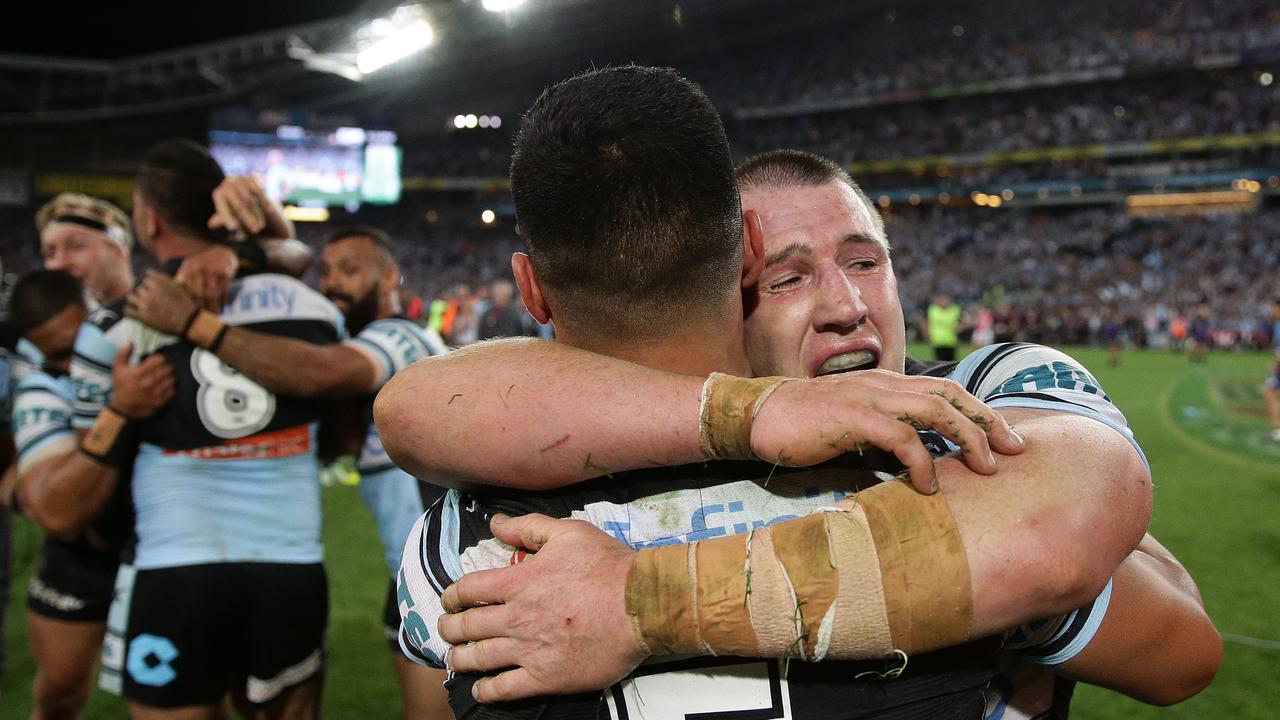 Shark's Paul Gallen and Valentine Holmes celebrate winning the grand final during the 2016. Picture: Brett Costello