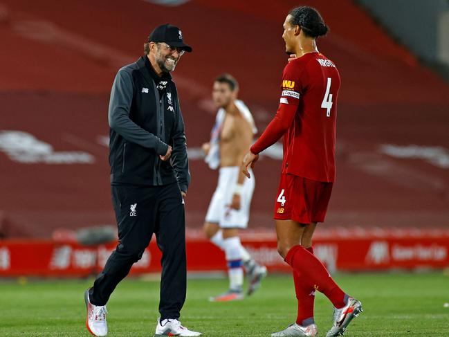 Jurgen Klopp and Virgil van Dijk. (Photo by PHIL NOBLE / POOL / AFP)