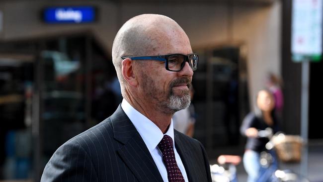 Former Victoria Police Chief Commissioner Simon Overland departs the Royal Commission. Picture: AAP