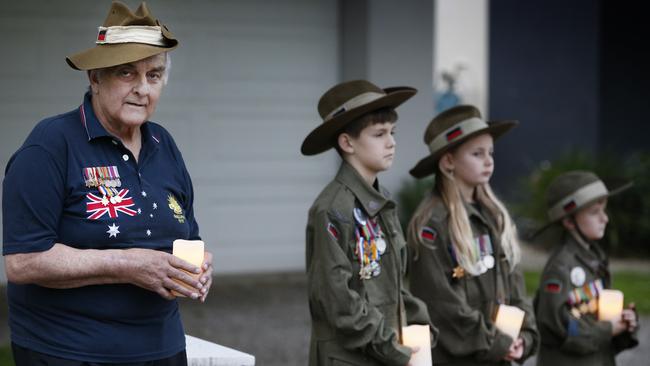 David Doughty 66, will stand and hold candles with his grandchildren Riley 10, Kaitlyn, 9 and William, 7 outside his house for the Anzac Day Dawn Service. Picture: David Caird