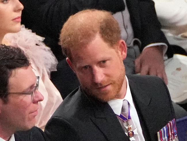 (L to R) Britain's Princess Eugenie of York, Jack Brooksbank and Britain's Prince Harry, Duke of Sussex attend the coronation ceremony of King Charles III and Queen Camilla in Westminster Abbey in central London on May 6, 2023. - The set-piece coronation is the first in Britain in 70 years, and only the second in history to be televised. Charles will be the 40th reigning monarch to be crowned at the central London church since King William I in 1066. Outside the UK, he is also king of 14 other Commonwealth countries, including Australia, Canada and New Zealand. Camilla, his second wife, will be crowned queen alongside him and be known as Queen Camilla after the ceremony. (Photo by Aaron Chown / POOL / AFP)