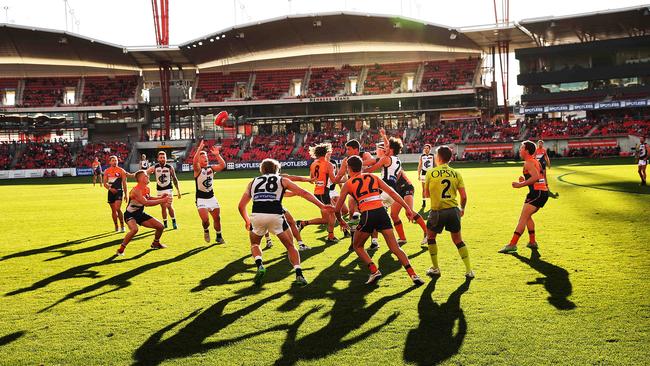 Carlton's Bradley Walsh takes the ball from a ruck contest ahead of Greater Western Sydney's Adam Treloar during AFL match GWS Giants v Carlton at Spotless Stadium. Picture. Phil Hillyard