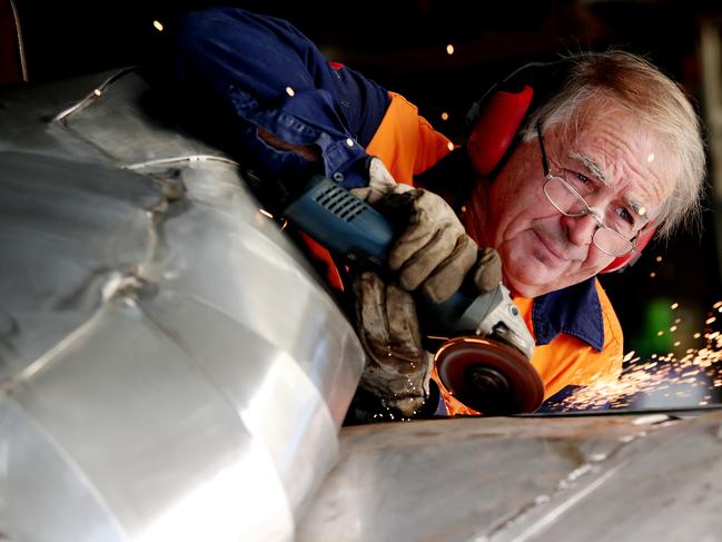 Sculptor Col Henry pictured in his workshop in Wyong Creek. Picture: Sue Graham