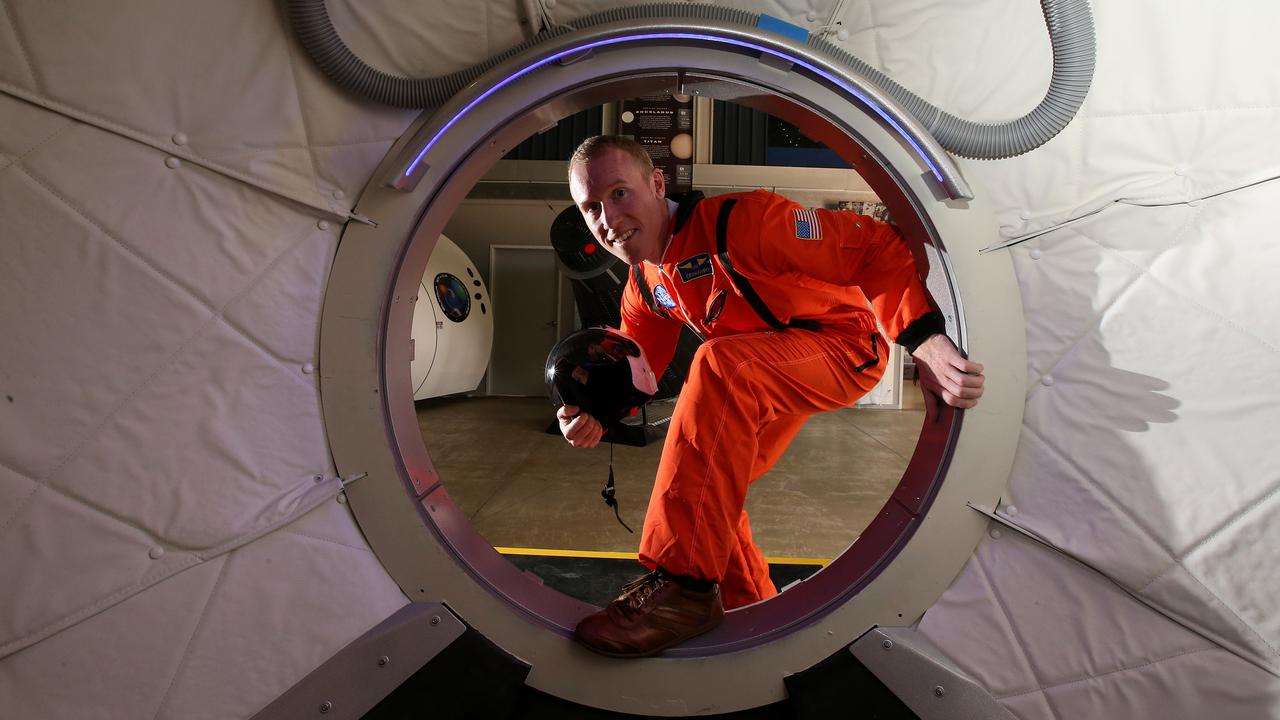 Adam Gilmour at the Gilmore Space Technologies space academy. The centre has various command and space craft displays. Picture: Scott Fletcher