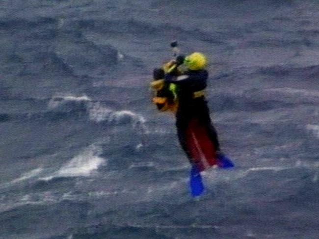 A yachtsman is winched to the rescue helicopter from the sea off the NSW Coast.