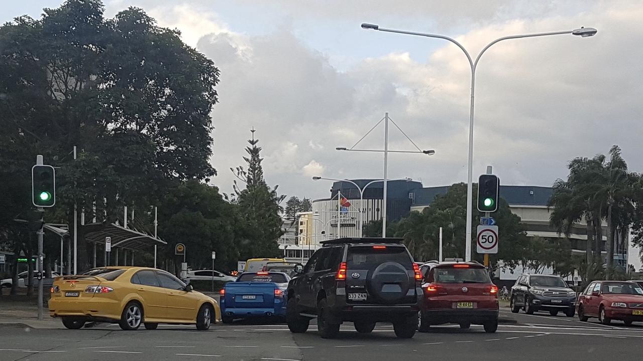 Four cars try to merge into two lanes near the border crossing at Coolangatta. Photo: Lachlan Doepel