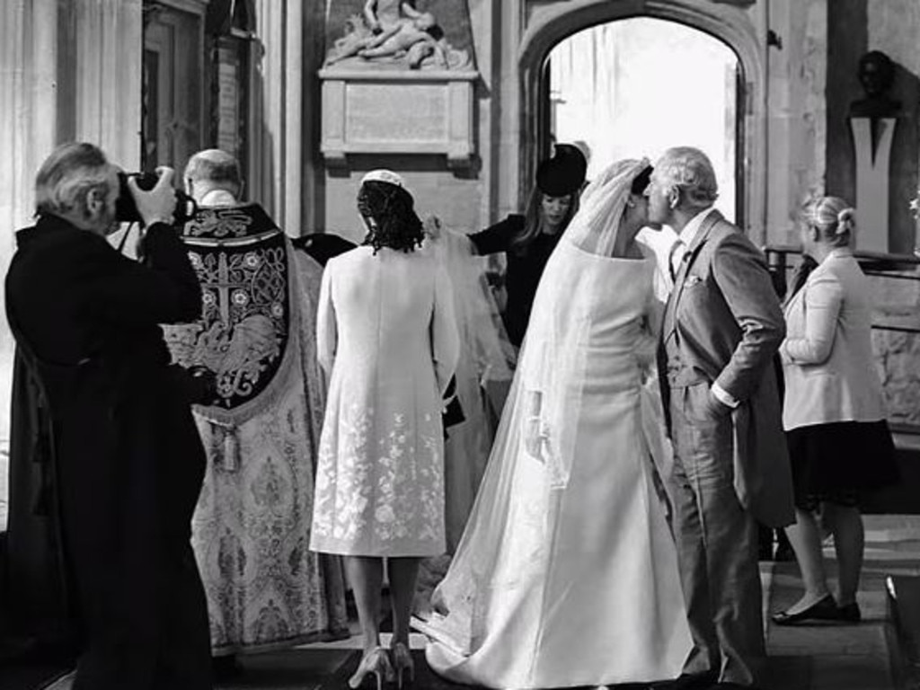 The-then Prince Charles kisses Meghan Markle. Picture: Netflix