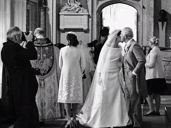 The-then Prince Charles kisses Meghan Markle. Picture: Netflix