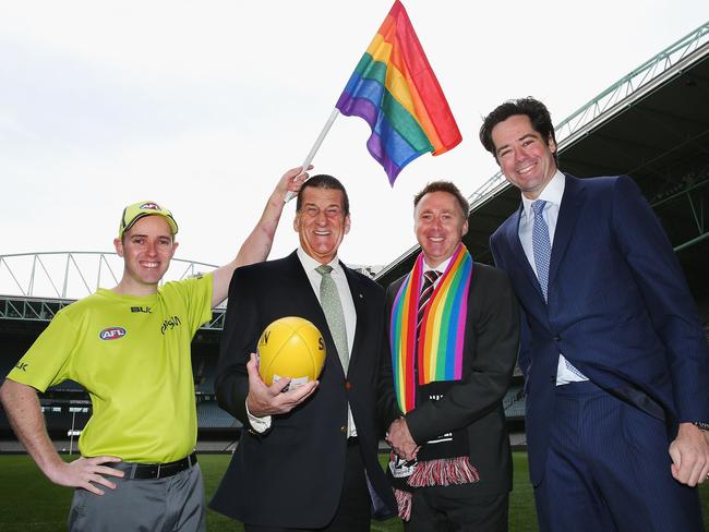 MELBOURNE, AUSTRALIA - AUGUST 09: AFL Goal umpire Michael Craig with the Pride Game rainbow goal umpire flag (L) beyondblue Chairman Jeff Kennett, St Kilda CEO Matt Finnis and beyondblue and AFL CEO Gillon McLachlan pose during an AFL media opportunity at Etihad Stadium on August 9, 2016 in Melbourne, Australia. St.Kilda Saints will play Sydney Swans in the Pride Game on the weekend. (Photo by Michael Dodge/Getty Images)