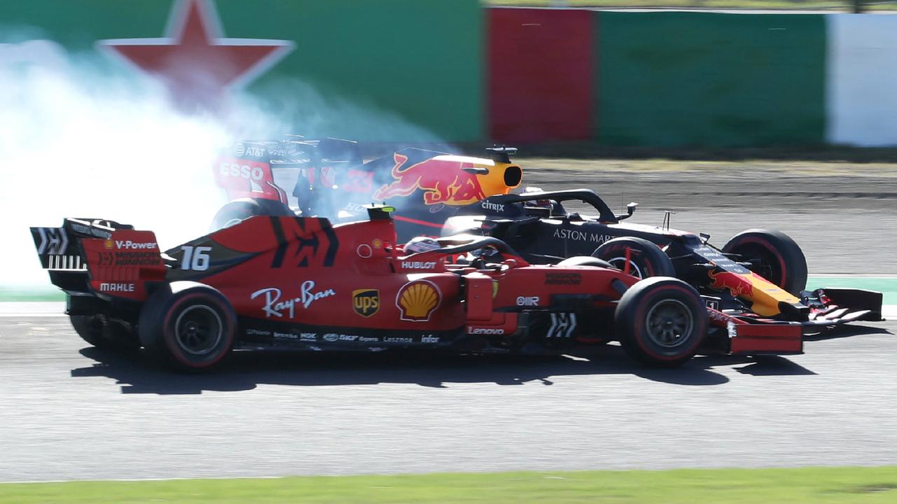 Max Verstappen collides with Charles Leclerc after the start of the Japanese Grand Prix.