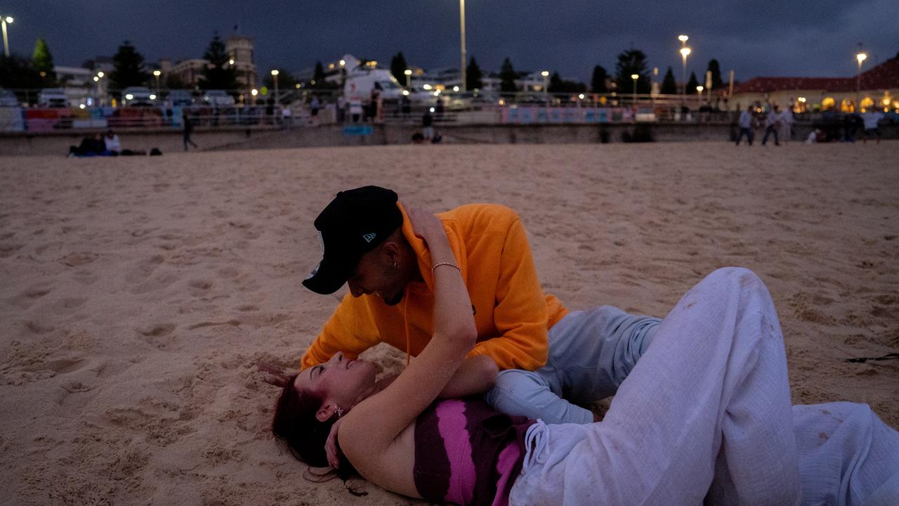 A couple embraces on the sand before the sun rose. Picture: NCA NewsWire / Mario Francisco 