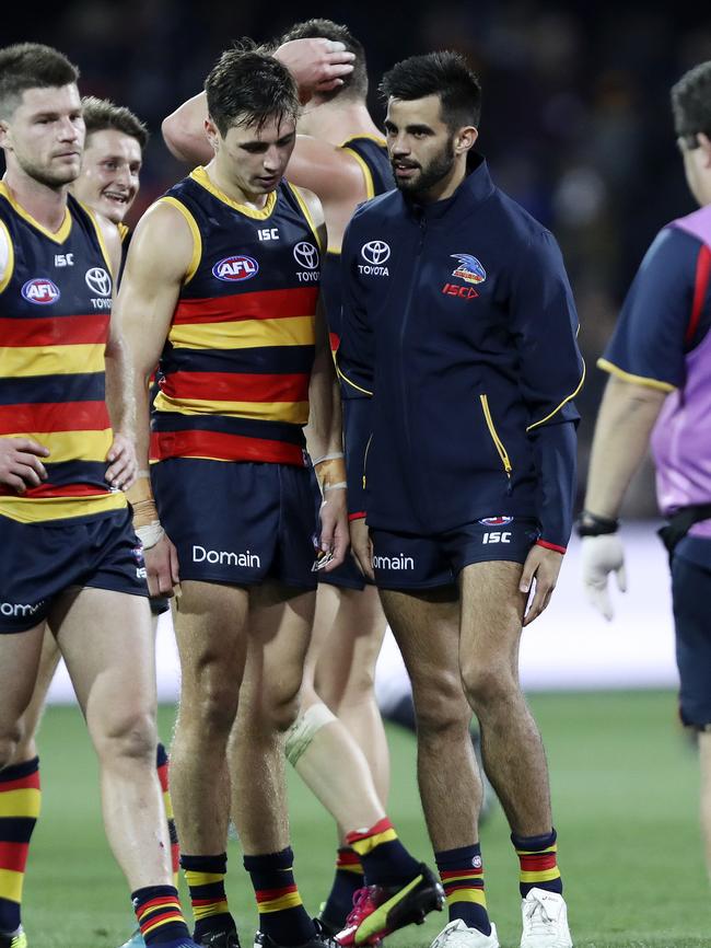 Wayne Milera grabs at his leg after injuring himself against Carlton on Saturday night. He failed to return to the field in the second half. Picture: Sarah Reed