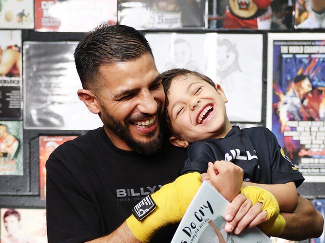 The Daily Telegraph 4.12..2024 Former world champion boxer Billy Dib has written a book, Boys Do Cry, encouraging young males to express their emotions. Pictured with his son Laith Dib, 5, in his Narwee home gym. Picture: Rohan Kelly.