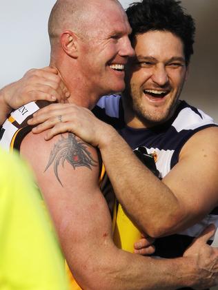 Barry Hall (Wangaratta) and Brendan Fevola (Yarrawonga) share the love.