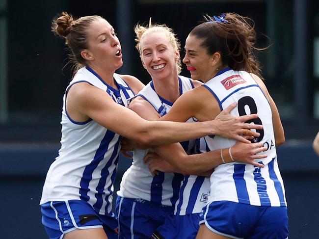 MELBOURNE, AUSTRALIA - NOVEMBER 12: (L-R) Emma King, Kate Shierlaw and Taylah Gatt of the Kangaroos celebrate during the 2023 AFLW Second Qualifying Final match between The Melbourne Demons and The North Melbourne Tasmanian Kangaroos at IKON Park on November 12, 2023 in Melbourne, Australia. (Photo by Michael Willson/AFL Photos via Getty Images)