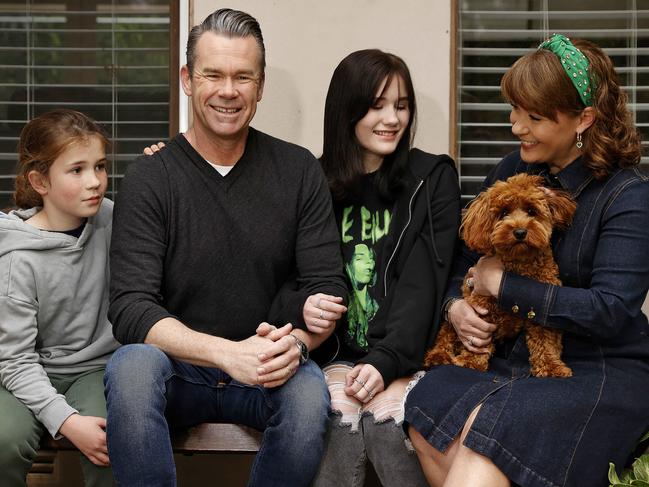 WEEKEND TELEGRAPH - 23.8.23MUST NOT PUBLISH BEFORE CLEARING WITH WEEKEND TELEGRAPH PIC EDITOR-Australian singer Phil Burton pictured at home with his family today. Son Xavier (left), daughter Ash and wife Justine. Picture: Sam Ruttyn