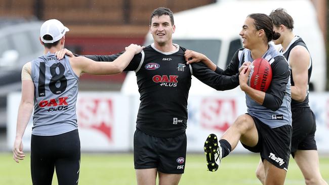 Port Adelaide’s Tom Rockliff with Zac Butters and Kai Pudney at training. Picture: Sarah Reed