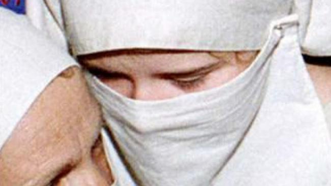 Veiled Elizabeth Smart at a party attended with her kidnappers in Salt Lake City.