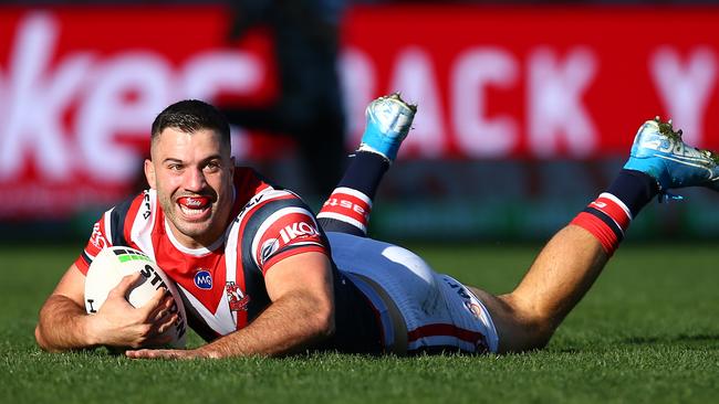 SYDNEY, AUSTRALIA - JULY 20: James Tedesco of the Roosters scores a try during the round 18 NRL match between the Sydney Roosters and the Newcastle Knights at Sydney Cricket Ground on July 20, 2019 in Sydney, Australia. (Photo by Jason McCawley/Getty Images)