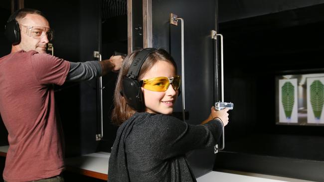 Steve, 30, and Louise, 12, shooting at the range at The Gunnery Christies Beach when it opened in 2016. Picture: Stephen Laffer