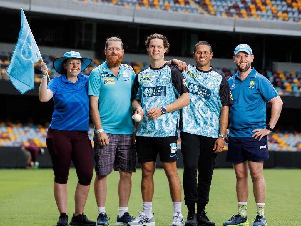 Brisbane Heat players Mitch Swepson and Usman Khawaja, with fans Brook O’Keeffe, John Savage and Greg Abell at the Gabba before their opening round game against the Melbourne Stars. Picture Lachie Millard